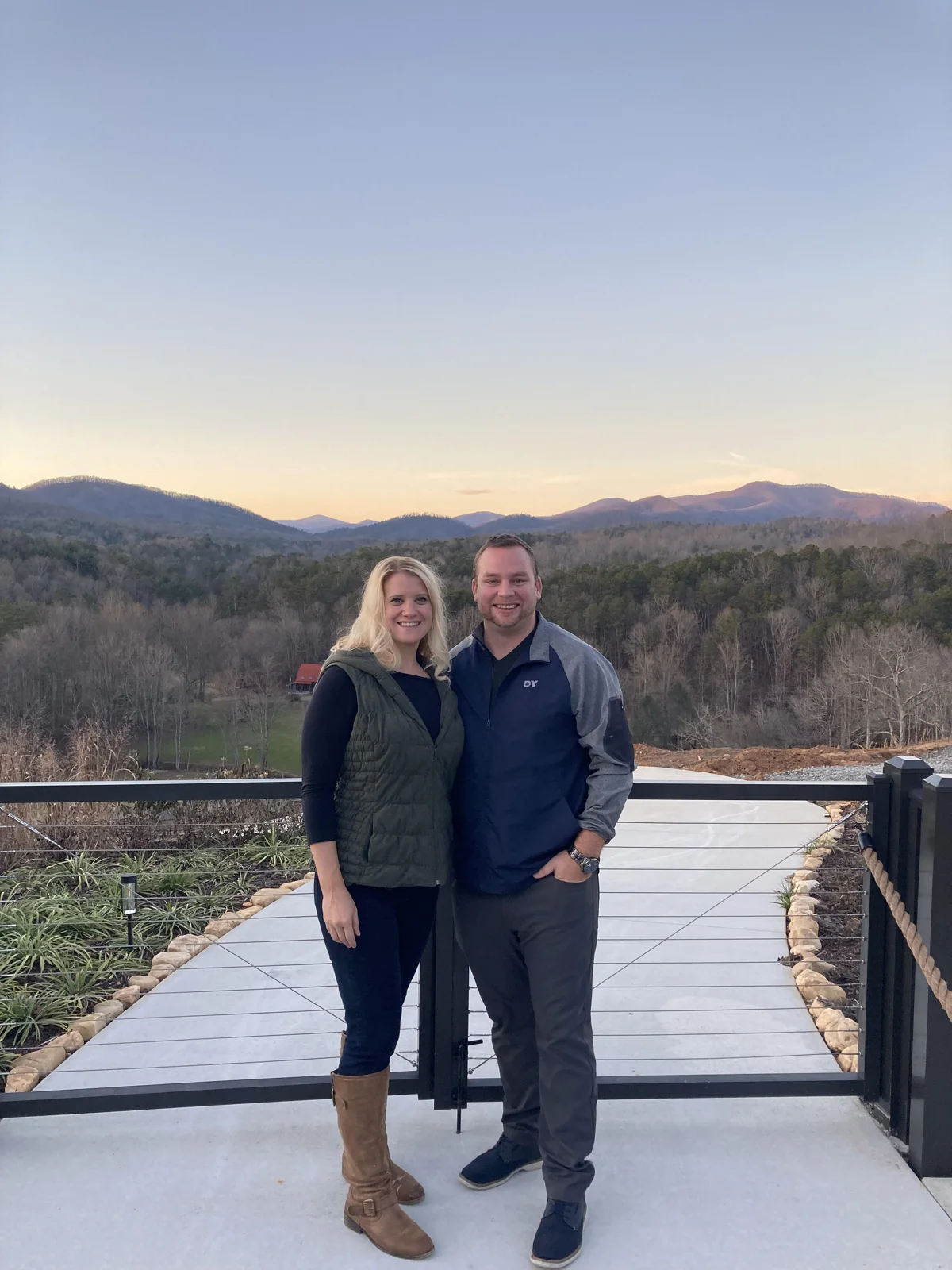 A couple on a vineyard terrace at sunset