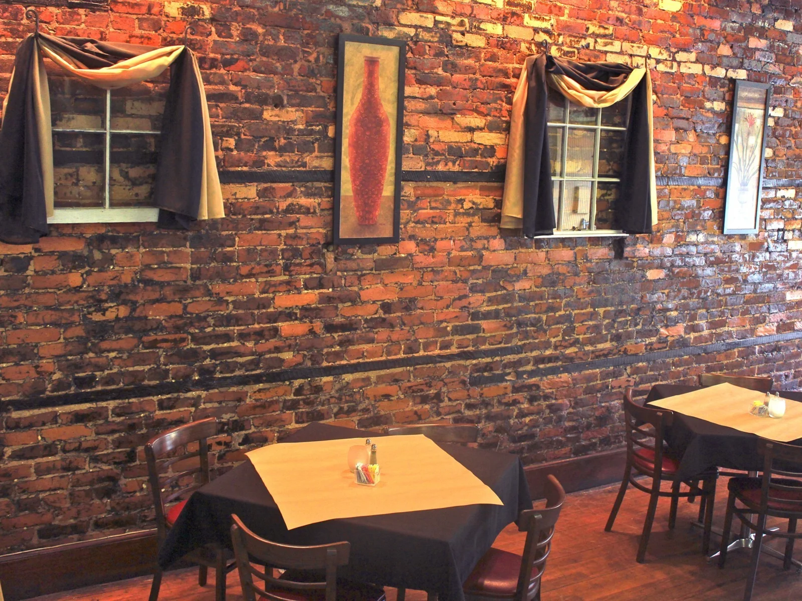 Exposed-brick dining space at X-Factor Grill