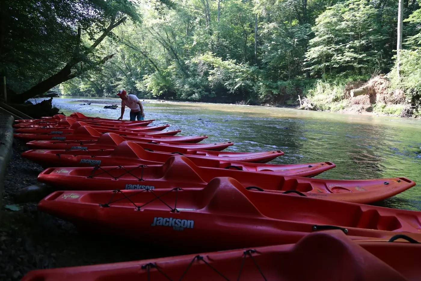 Paddlers in rental kayaks on a North Georgia river with Appalachian Outfitters