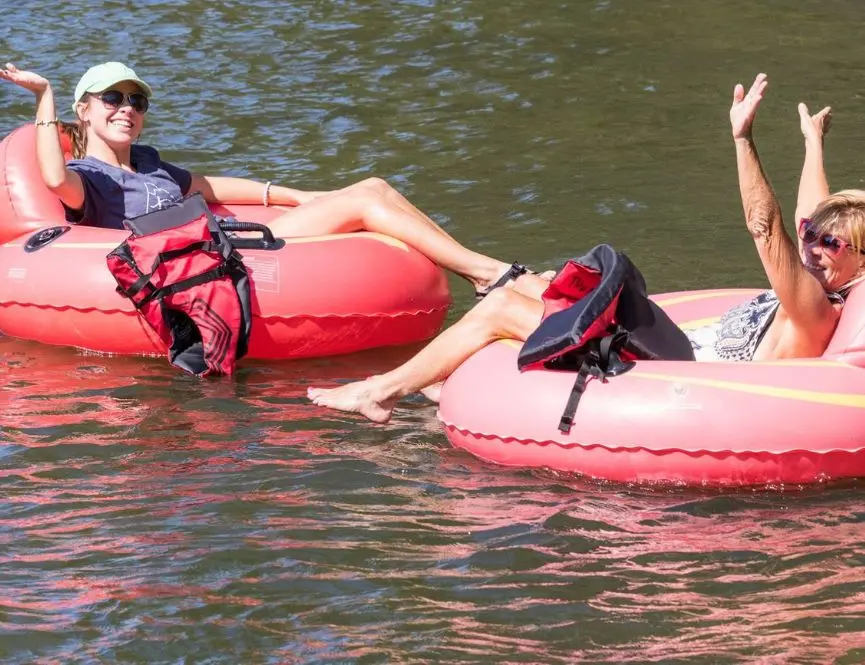 Guests tubing in life jackets on the Toccoa River with Rolling Thunder River Company