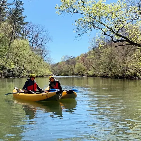 Two paddlers in a tandem kayak on the Upper Chattahoochee River