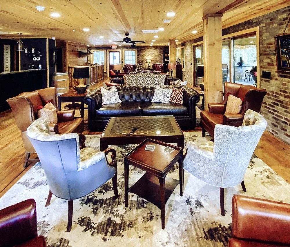 Rustic tasting-room seating and bar at Cavender Creek