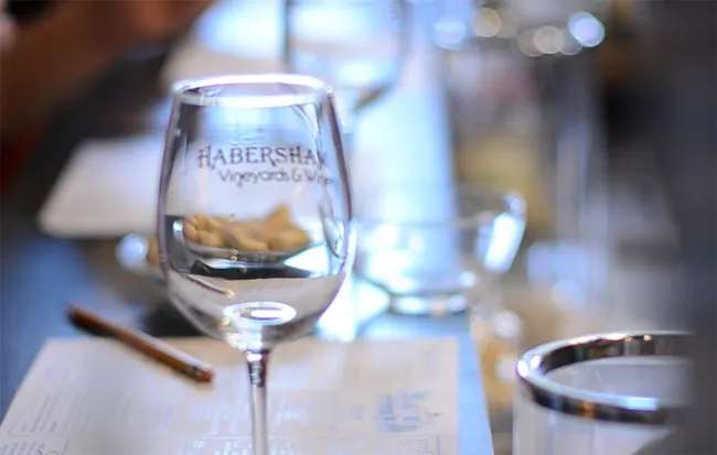 Habersham-branded wine glass in the tasting room