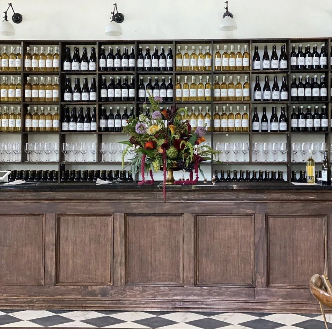 Wooden bar and wine display at Limoges Cellars
