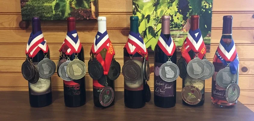 Little Vine wine bottles with award medals