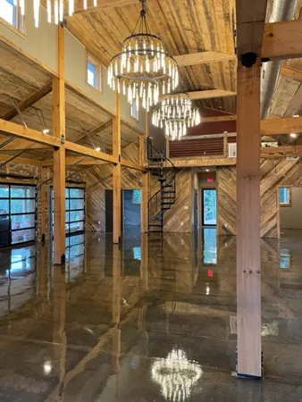 Timber beams and chandeliers in Living Water Winery tasting room