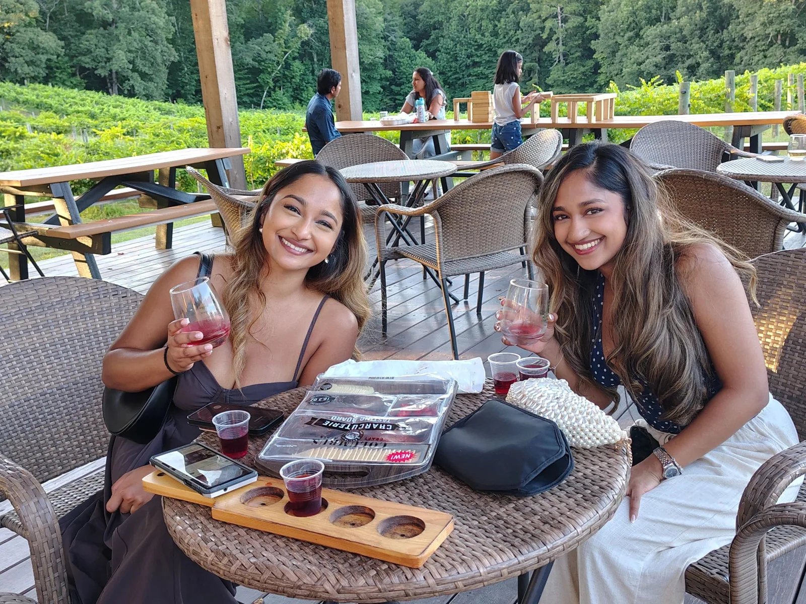 Guests enjoying a wine flight on the covered patio