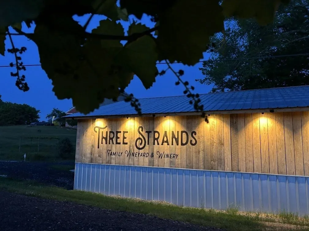 Three Strands tasting room exterior at dusk
